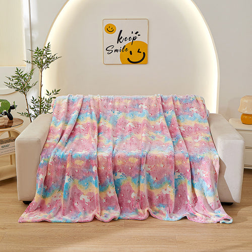 rainbow unicorn kids blanket on sofa